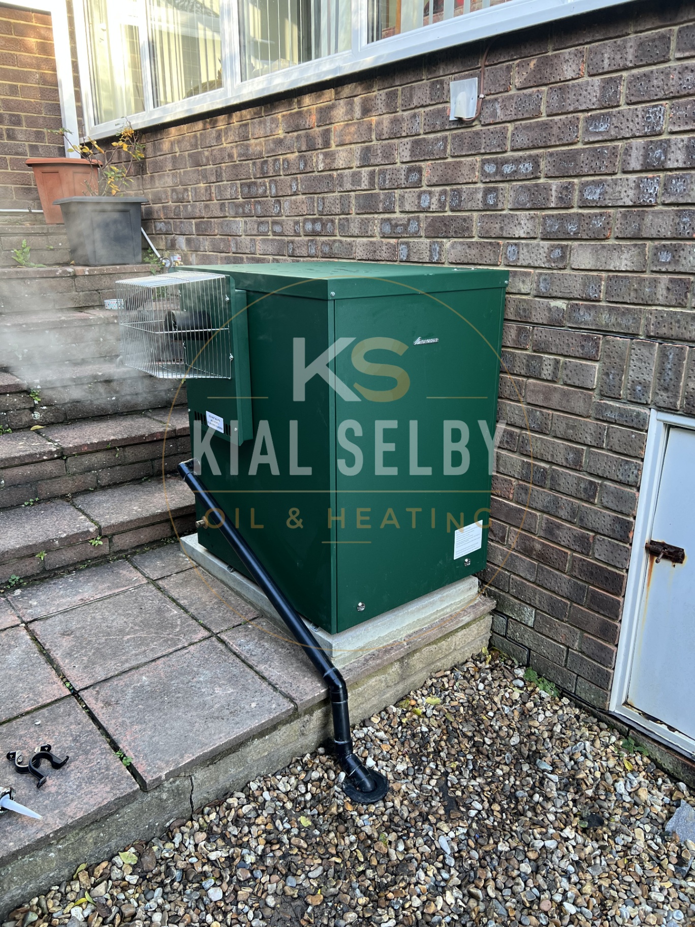 Kial Selby servicing an oil boiler in a Ventnor home
